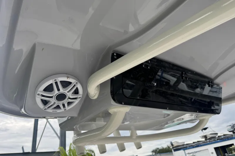 Slide: The Image of 2026 Key West 239 FS boat underside with speaker and rod holders. - 32