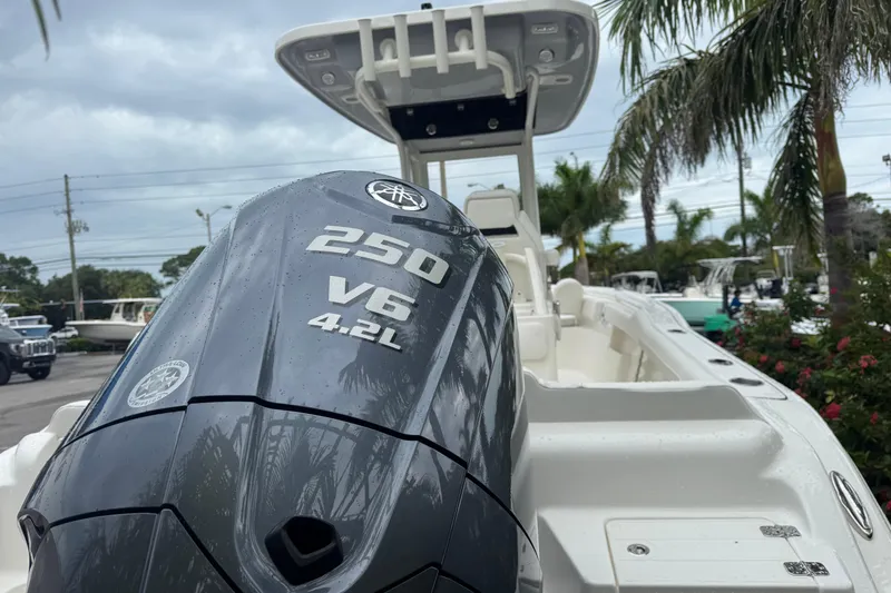 Slide: The Image of 2026 Key West 239 FS boat with Yamaha 250 V6 engine, parked outdoors. - 6