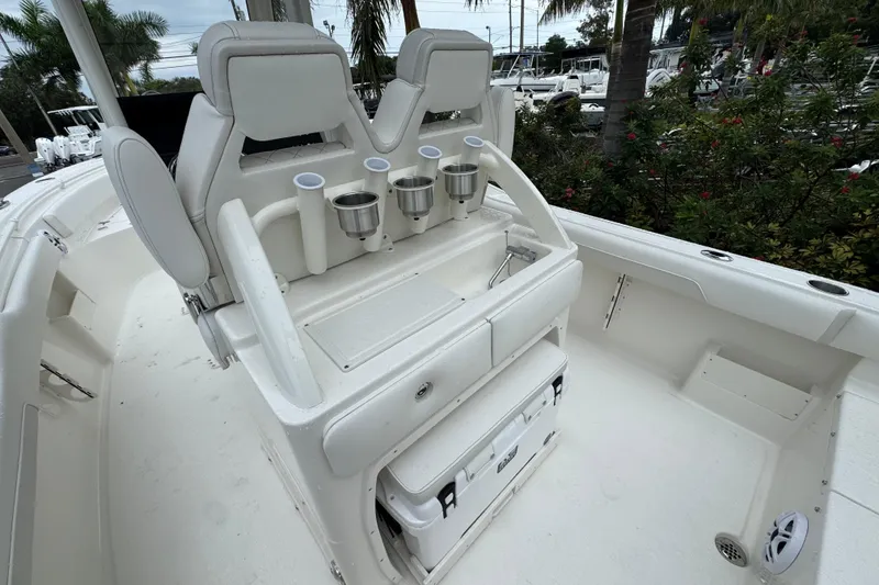 Slide: The Image of 2026 Key West 239 FS boat interior with seating and cup holders. - 9
