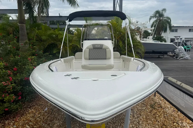 Slide: The Image of 2026 Key West 189 FS boat displayed outdoors with lush greenery background. - 15