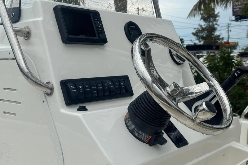 Slide: The Image of Steering console of 2026 Key West 189 FS boat with controls and display. - 21