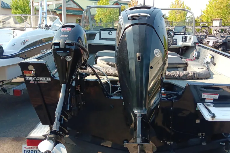 Slide: The Image of 2017 Tracker Pro Guide V-175 WT boat with dual outboard motors. - 7