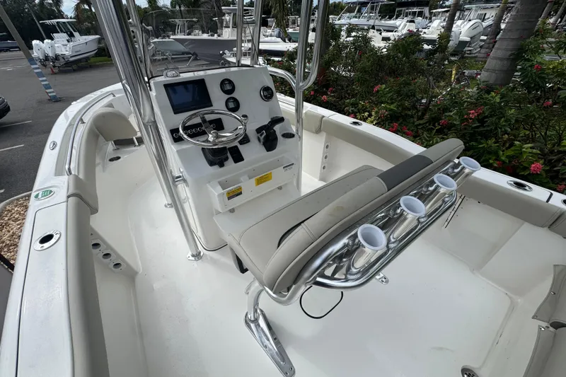 Slide: The Image of 2026 Key West 203 FS boat interior with steering console and seating. - 13