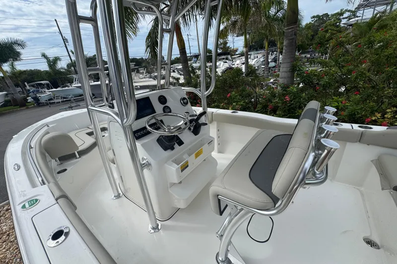 Slide: The Image of 2026 Key West 203 FS boat interior with steering console and seating. - 17