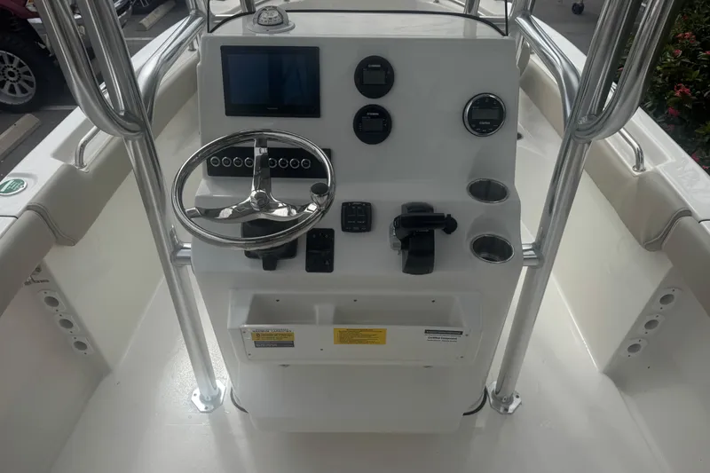 Slide: The Image of 2026 Key West 203 FS boat console with steering wheel and control panel. - 21