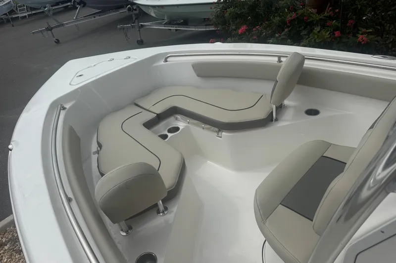 Slide: The Image of 2026 Key West 203 FS boat interior with cushioned seating and sleek design. - 27