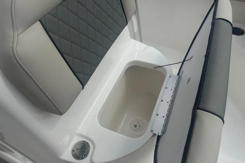 Slide: The Image of 2026 Key West 203 FS boat seat with storage compartment open. - 32