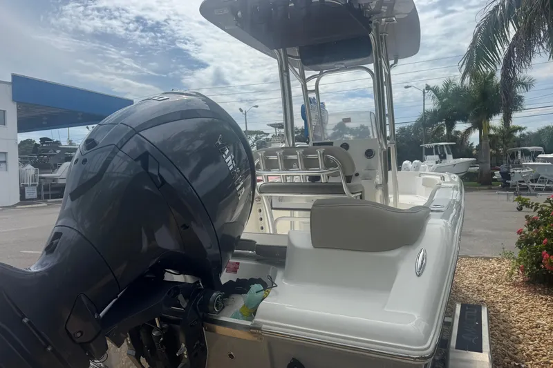 Slide: The Image of 2026 Key West 203 FS boat with Yamaha outboard motor, parked outdoors. - 6