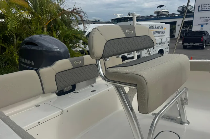 Slide: The Image of 2026 Key West 189 FS boat interior with Yamaha engine, featuring cushioned seating. - 8