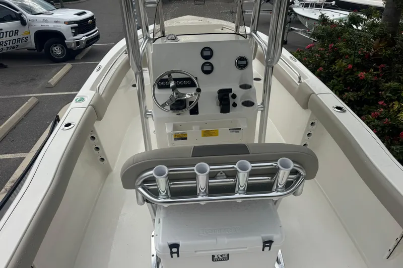 Slide: The Image of 2026 Key West 203 FS boat interior with steering console and rod holders. - 10