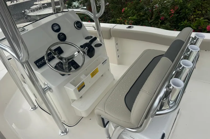 Slide: The Image of 2026 Key West 203 FS boat console with steering wheel and seating. - 13