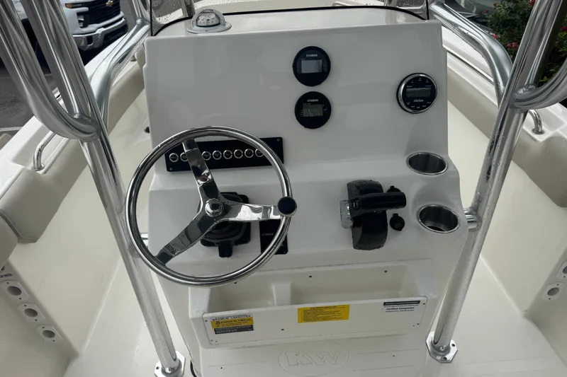 Slide: The Image of 2026 Key West 203 FS boat console with steering wheel and gauges. - 14