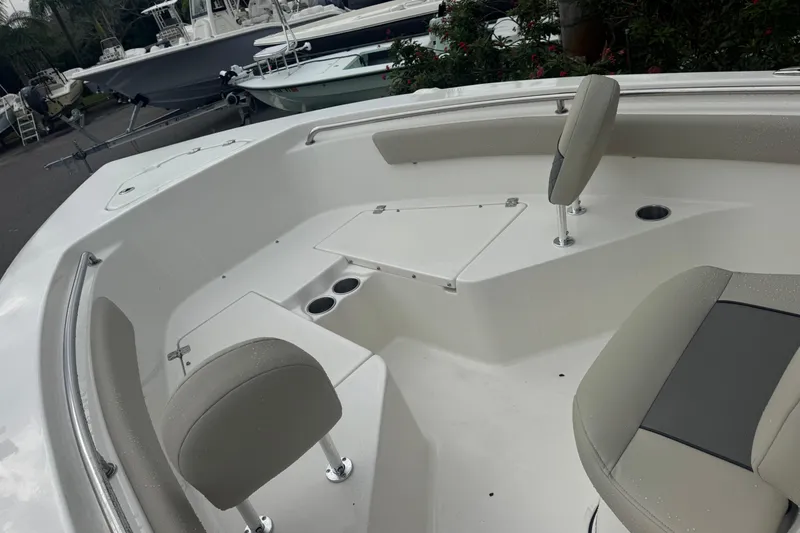 Slide: The Image of 2026 Key West 203 FS boat interior with seating and storage compartments. - 17