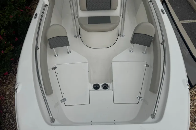 Slide: The Image of 2026 Key West 203 FS boat interior with seating and storage compartments. - 18