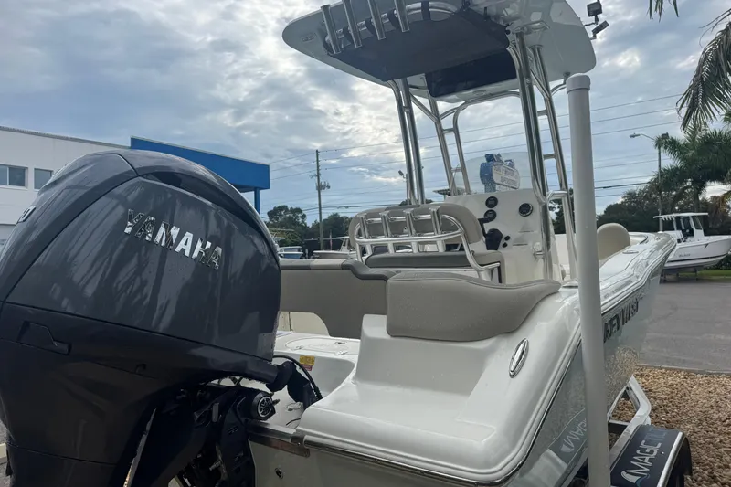 Slide: The Image of 2026 Key West 203 FS boat with Yamaha engine, parked outdoors under cloudy sky. - 7