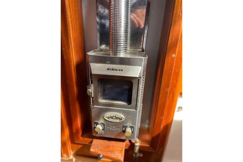 Slide: The Image of Dickinson Newport heater inside 1983 Nonsuch 30 Classic sailboat cabin. - 16