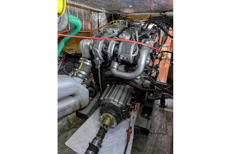 Slide: The Image of Engine compartment of a 1983 Nonsuch 30 Classic sailboat, showcasing mechanical components. - 19