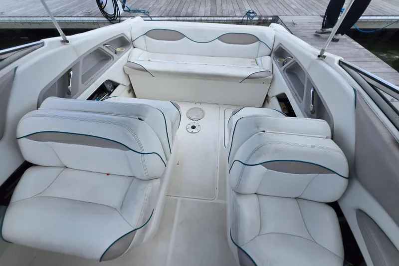 Slide: The Image of 1996 Wellcraft 2600s Eclipse Bowrider interior with white seating and spacious layout. - 10
