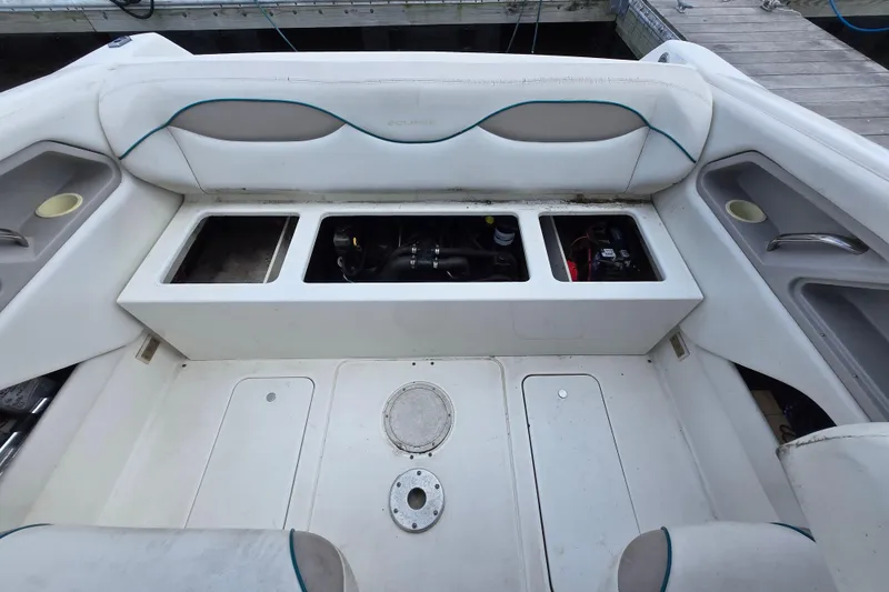 Slide: The Image of 1996 Wellcraft 2600s Eclipse Bowrider interior with open engine compartment and seating. - 17