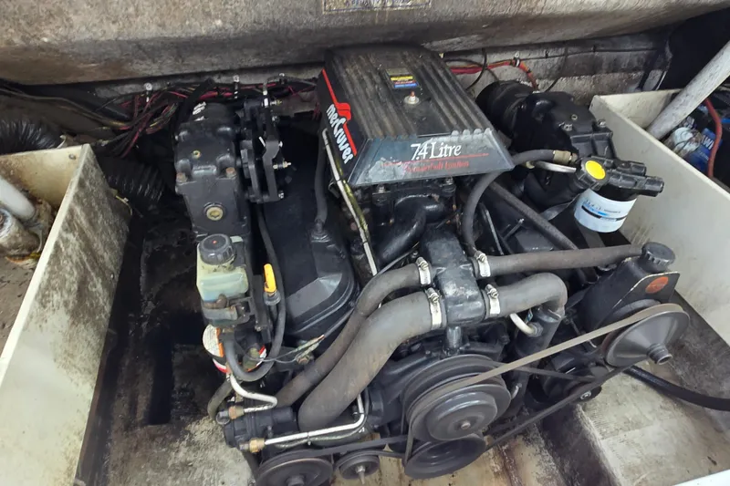 Slide: The Image of Engine compartment of a 1996 Wellcraft 2600s Eclipse Bowrider, featuring a 7.4L MerCruiser engine. - 22
