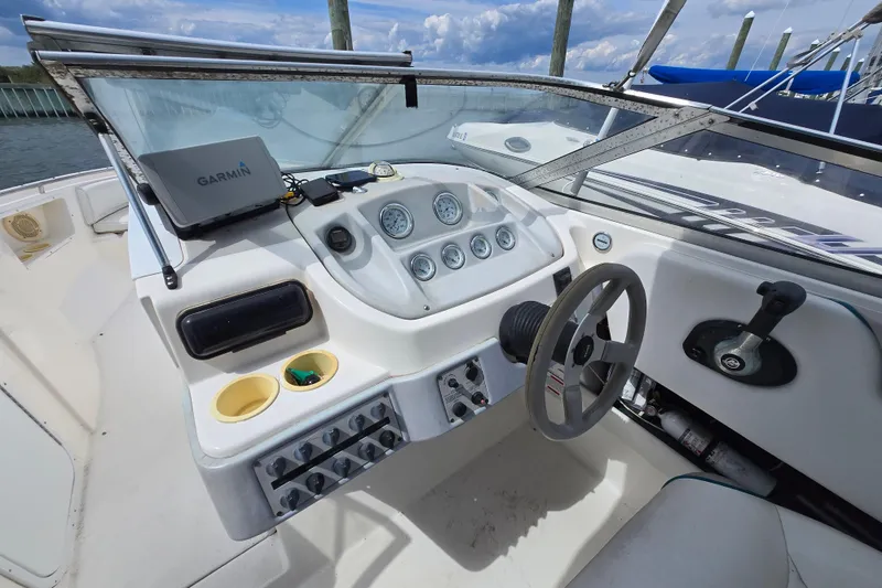 Slide: The Image of 1996 Wellcraft 2600s Eclipse Bowrider dashboard with Garmin GPS and steering wheel. - 4