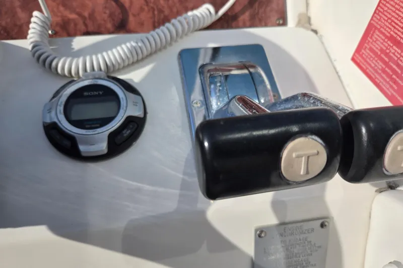 Slide: The Image of 1994 Sea Ray 400 Express Cruiser controls with Sony marine audio system. - 21