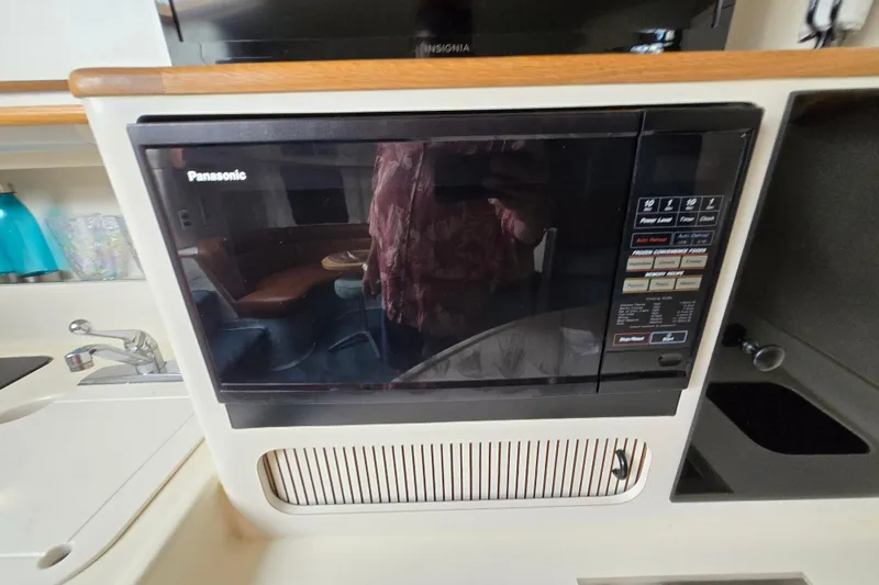 Slide: The Image of Panasonic microwave in 1994 Sea Ray 400 Express Cruiser kitchen area. - 27