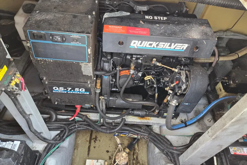 Slide: The Image of Engine compartment of a 1994 Sea Ray 400 Express Cruiser with Quicksilver marine generator. - 36