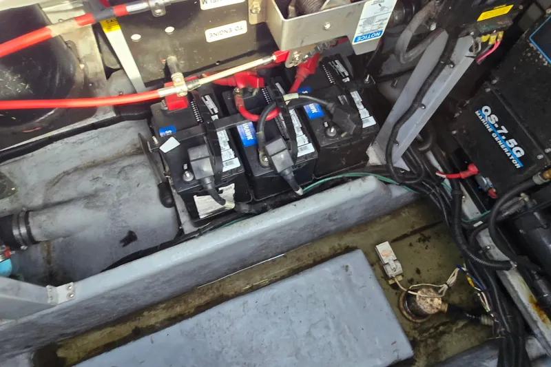 Slide: The Image of Engine compartment of a 1994 Sea Ray 400 Express Cruiser with batteries and wiring. - 38