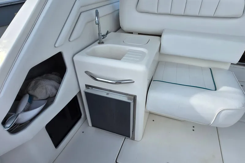 Slide: The Image of Interior of 1994 Sea Ray 400 Express Cruiser with sink and seating area. - 39