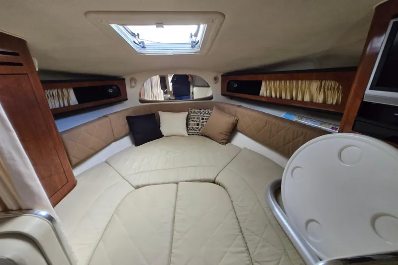 Slide: The Image of Interior cabin of 2006 Sea Ray 280 Sundancer with cozy seating and skylight. - 9