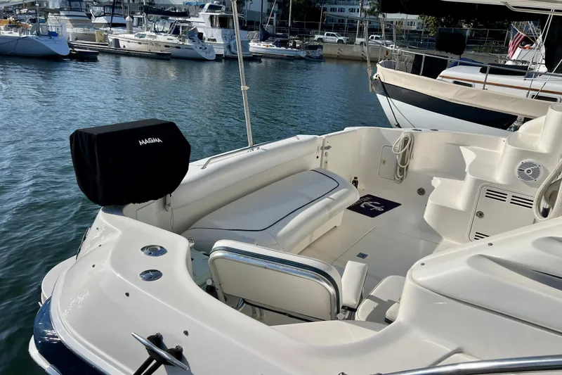 Slide: The Image of 2000 Sea Ray 400 Sedan Bridge yacht interior with seating, docked in marina. - 10