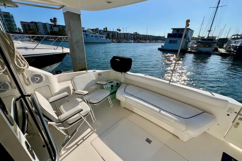 Slide: The Image of 2000 Sea Ray 400 Sedan Bridge yacht interior with seating, docked at marina. - 18
