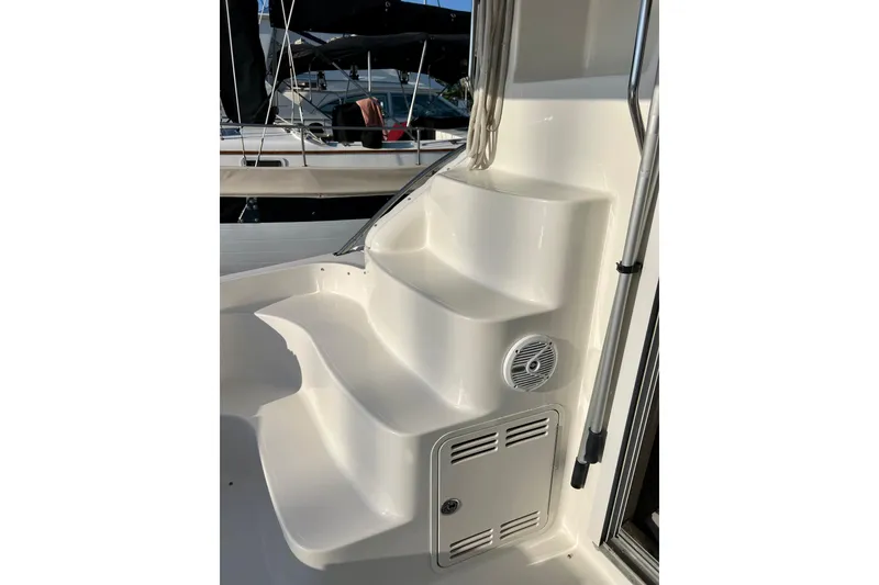 Slide: The Image of Staircase on a 2000 Sea Ray 400 Sedan Bridge yacht, featuring sleek white design. - 23