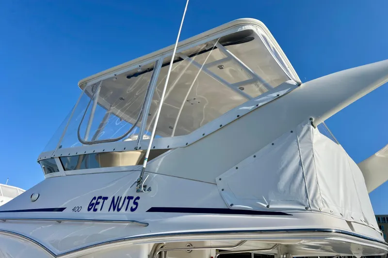 Slide: The Image of Sea Ray 400 Sedan Bridge 2000 yacht with custom name, clear skies background. - 30