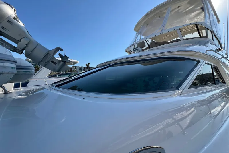 Slide: The Image of 2000 Sea Ray 400 Sedan Bridge yacht with sleek design under clear blue sky. - 39