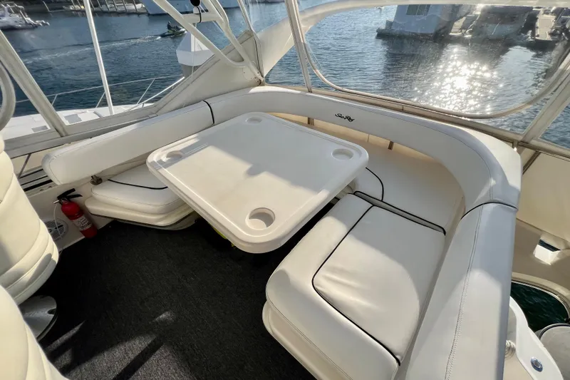 Slide: The Image of Luxurious seating area on 2000 Sea Ray 400 Sedan Bridge yacht, overlooking marina. - 50
