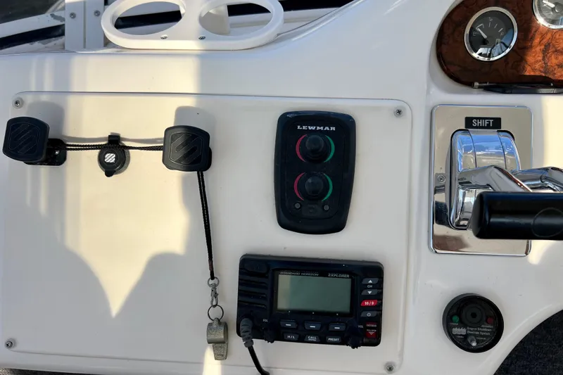 Slide: The Image of Control panel of a 2000 Sea Ray 400 Sedan Bridge boat with navigation equipment. - 60
