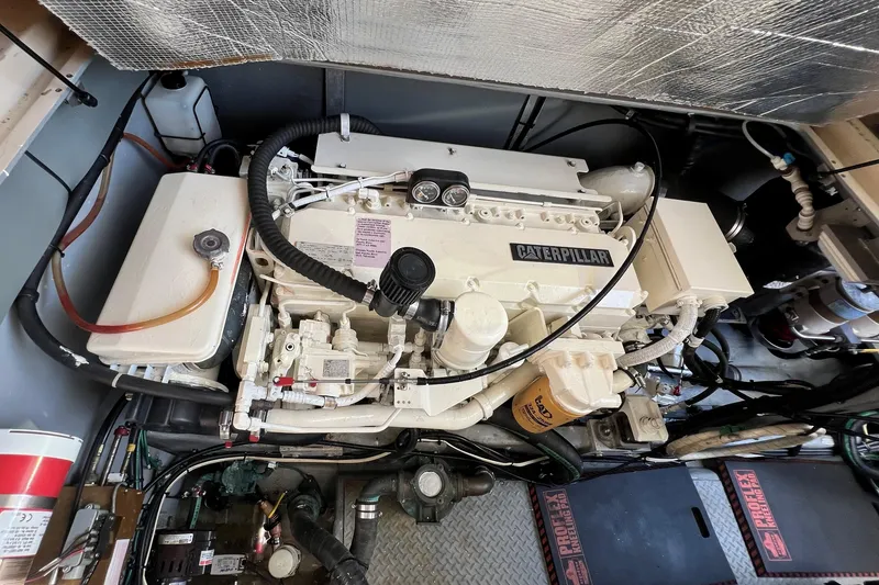 Slide: The Image of Engine room of 2000 Sea Ray 400 Sedan Bridge with Caterpillar engine. - 68