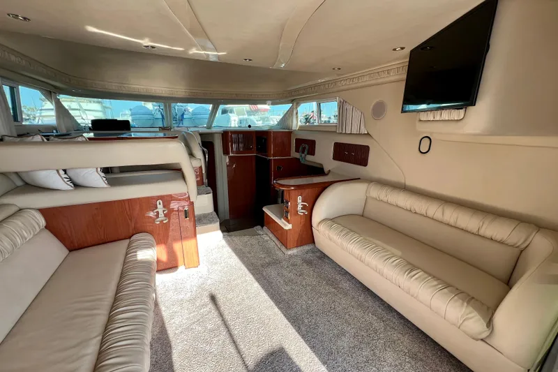 Slide: The Image of Luxurious interior of a 2000 Sea Ray 400 Sedan Bridge yacht with plush seating and modern amenities. - 73