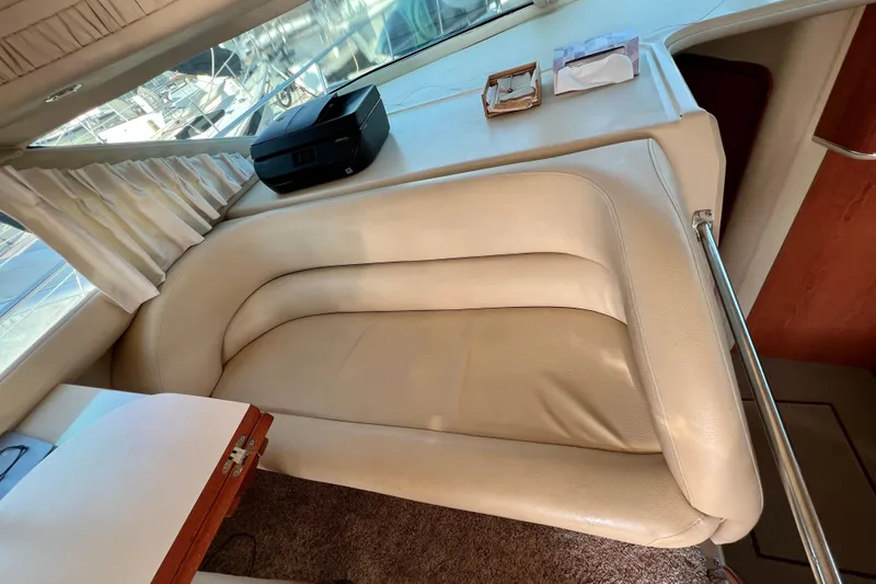 Slide: The Image of Luxurious interior of 2000 Sea Ray 400 Sedan Bridge with cream leather seating. - 87