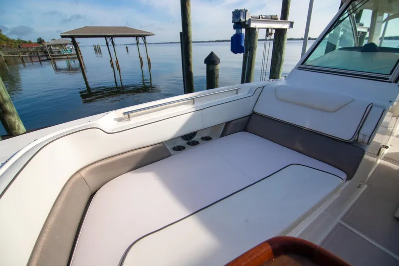Slide: The Image of 2016 World Cat 320 DC boat interior with comfortable seating by the water. - 12