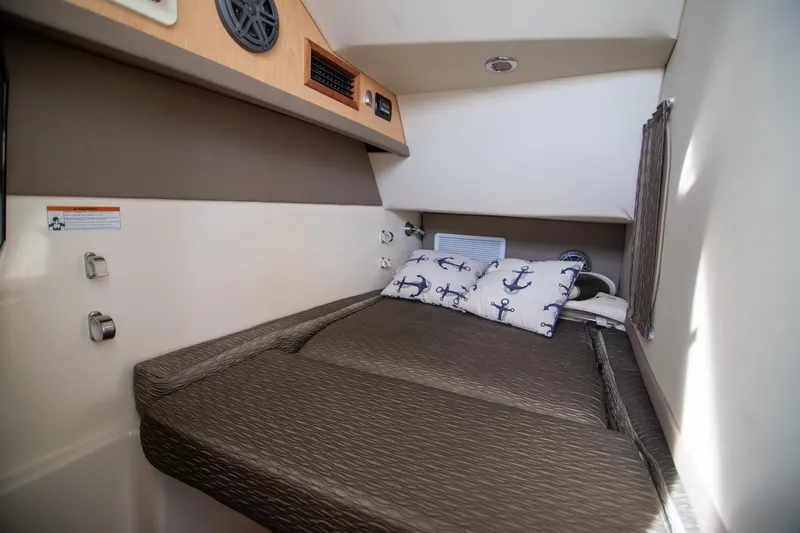 Slide: The Image of Cozy port side cabin interior of 2016 World Cat 320 DC  - 17