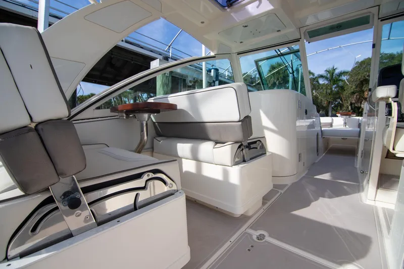 Slide: The Image of 2016 World Cat 320 DC interior with seating and table, showcasing modern design and comfort. - 24