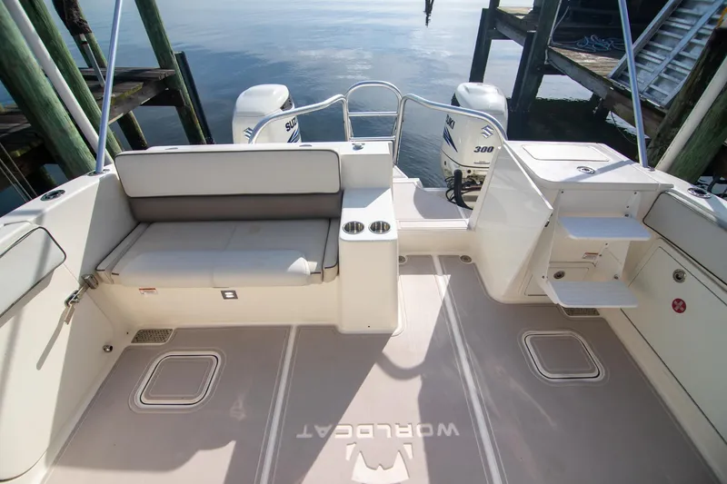 Slide: The Image of 2016 World Cat 320 DC boat interior with seating and twin Suzuki engines. - 29