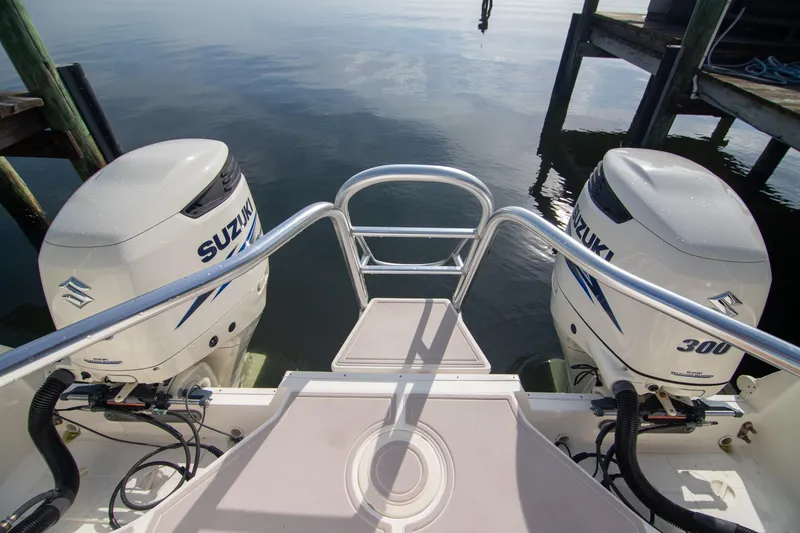 Slide: The Image of 2016 World Cat 320 DC boat with dual Suzuki 300 outboard engines at dock. - 31