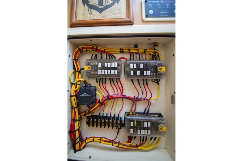 Slide: The Image of Electrical panel with organized wiring in a 2016 World Cat 320 DC boat. - 32