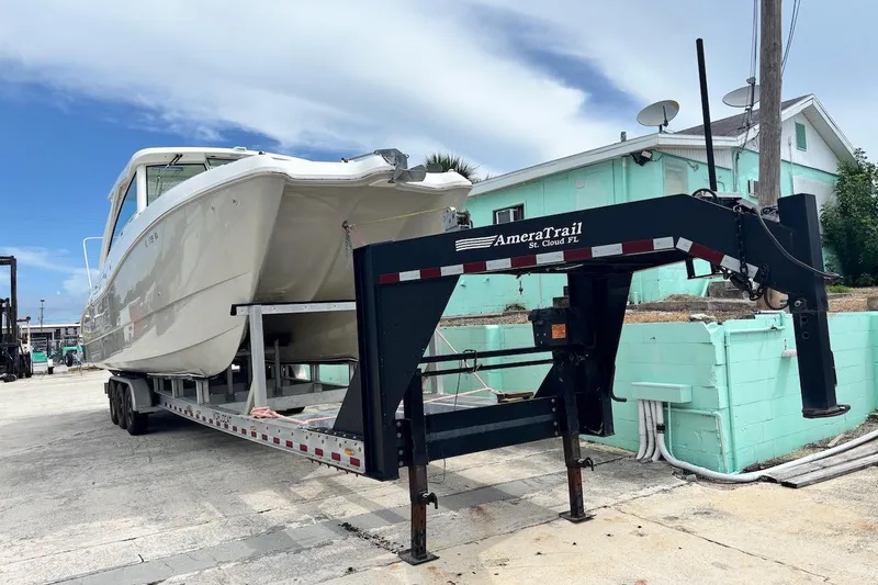 Slide: The Image of 2016 World Cat 320 DC boat on included gooseneck AmeraTrail trailer - 6