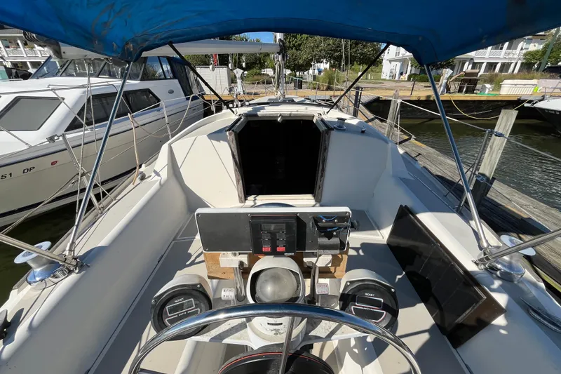 Slide: The Image of 1985 O'Day 35 sailboat cockpit with steering wheel and navigation instruments. - 3