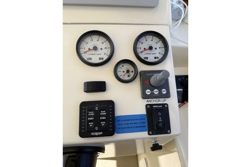Slide: The Image of Control panel of a 2020 Eastern Islander 270 boat with gauges and switches. - 11